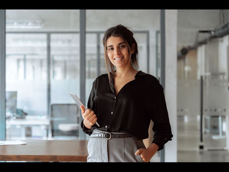 Woman Smiling And Holding Files