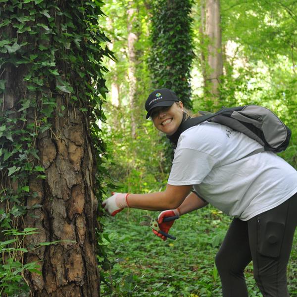 Assurant employee smiling during outdoor charity event