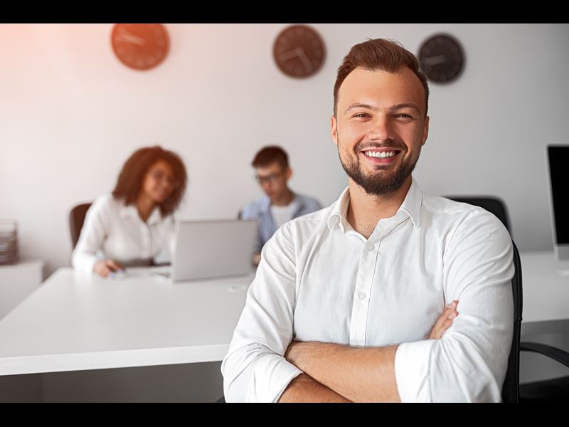 Man Smiling With Arms Folded