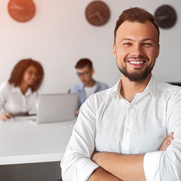 Man Smiling With Arms Folded