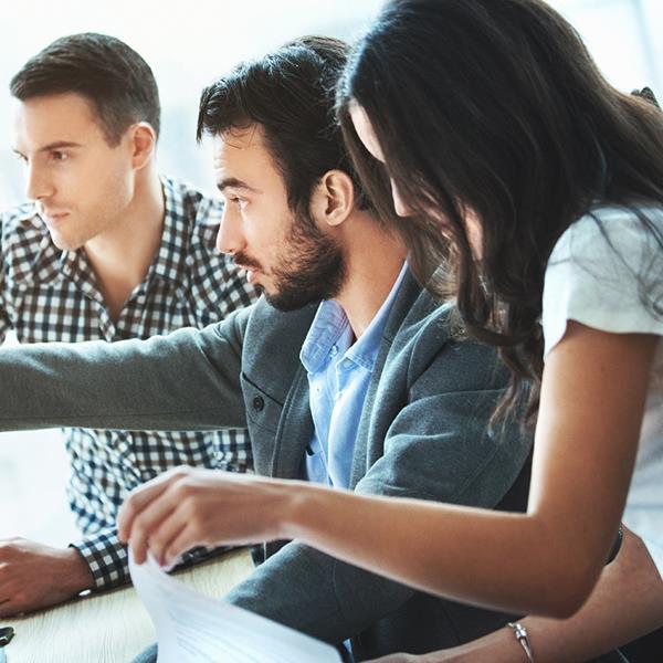 BUSINESS TEAM Looking At Screen Getty 857906012 LR