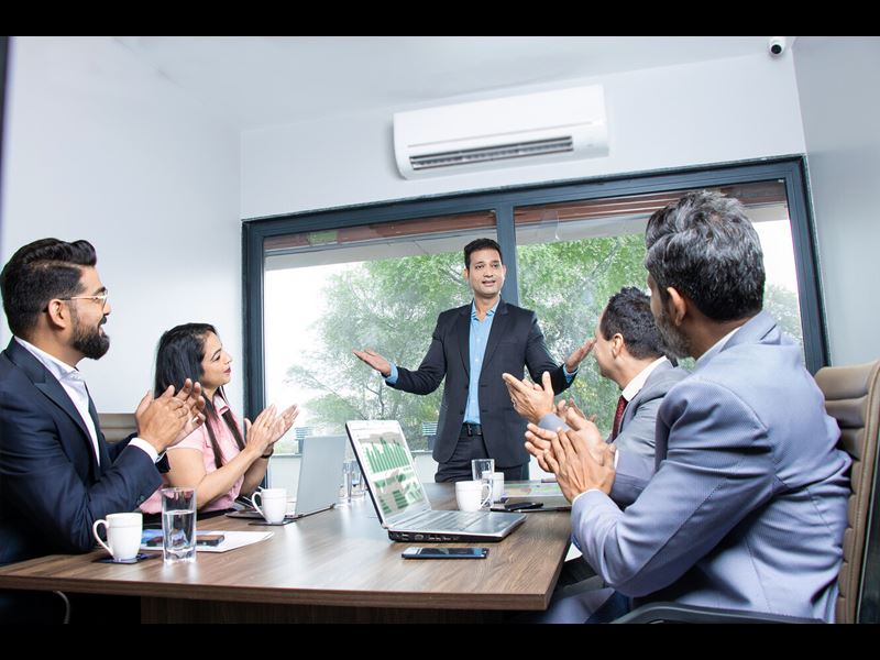 Indian Businesspeople Clapping And Appreciating Businessman At Conference