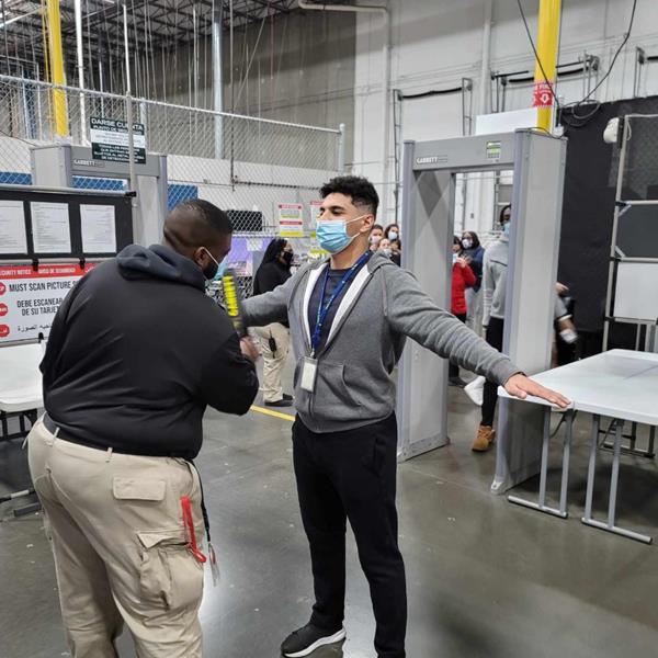 Assurant Loss Prevention Agent scanning employees as they enter building