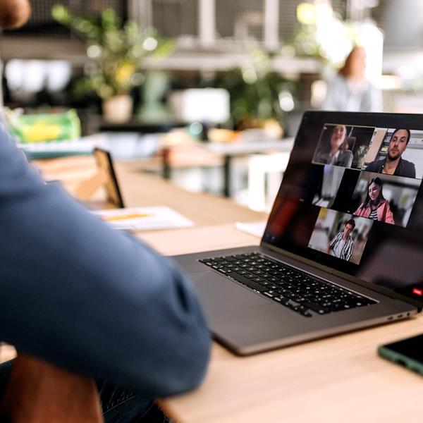 Person Sitting On A Video Conference On Laptop
