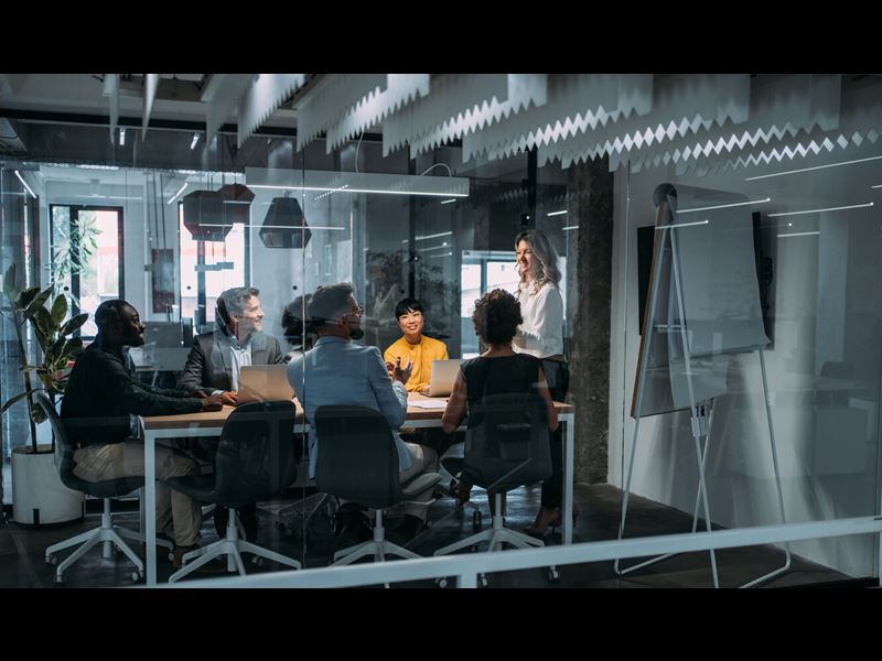Group Of Professionals Sitting In Conference Room