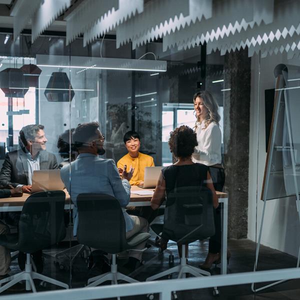 Group Of Professionals Sitting In Conference Room