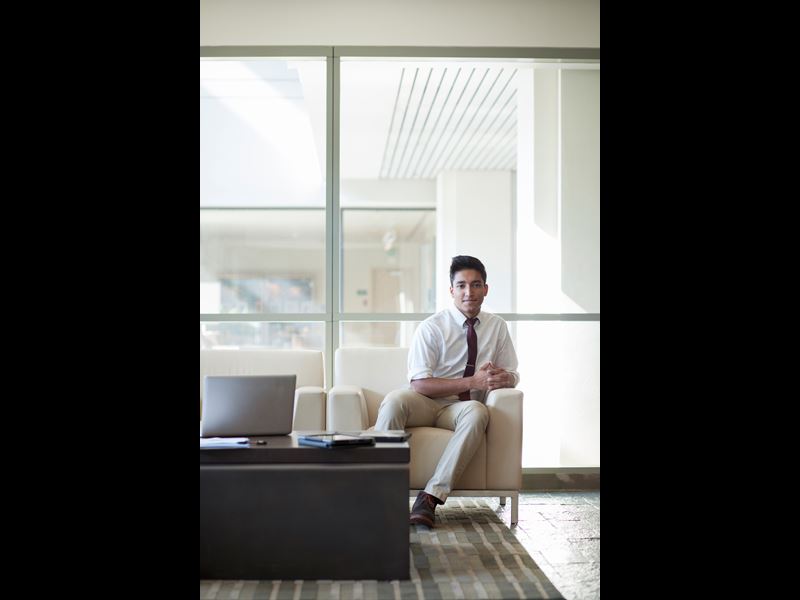 Man sitting on couch in office