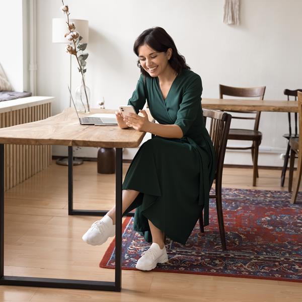 Woman Smiling And Texting On Phone
