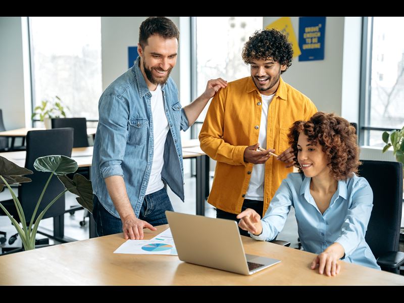 Team Working Together In A Hybrid Office