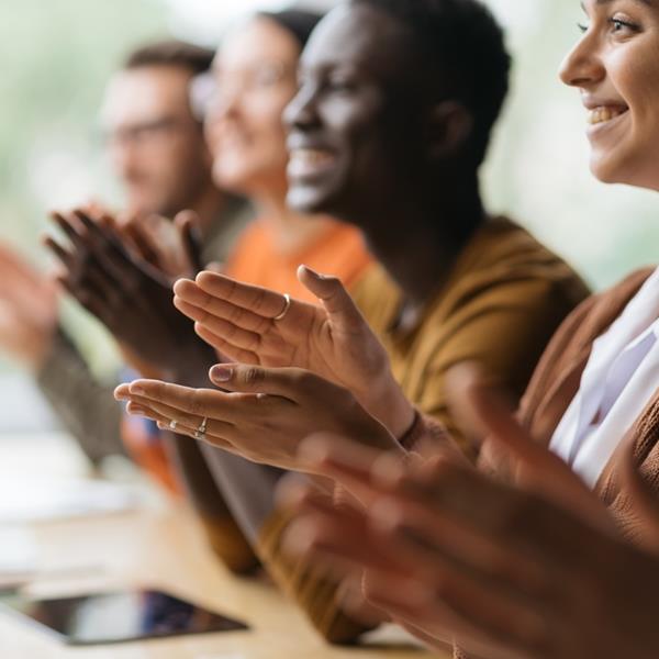 Diverse Employees Smiling And Applauding
